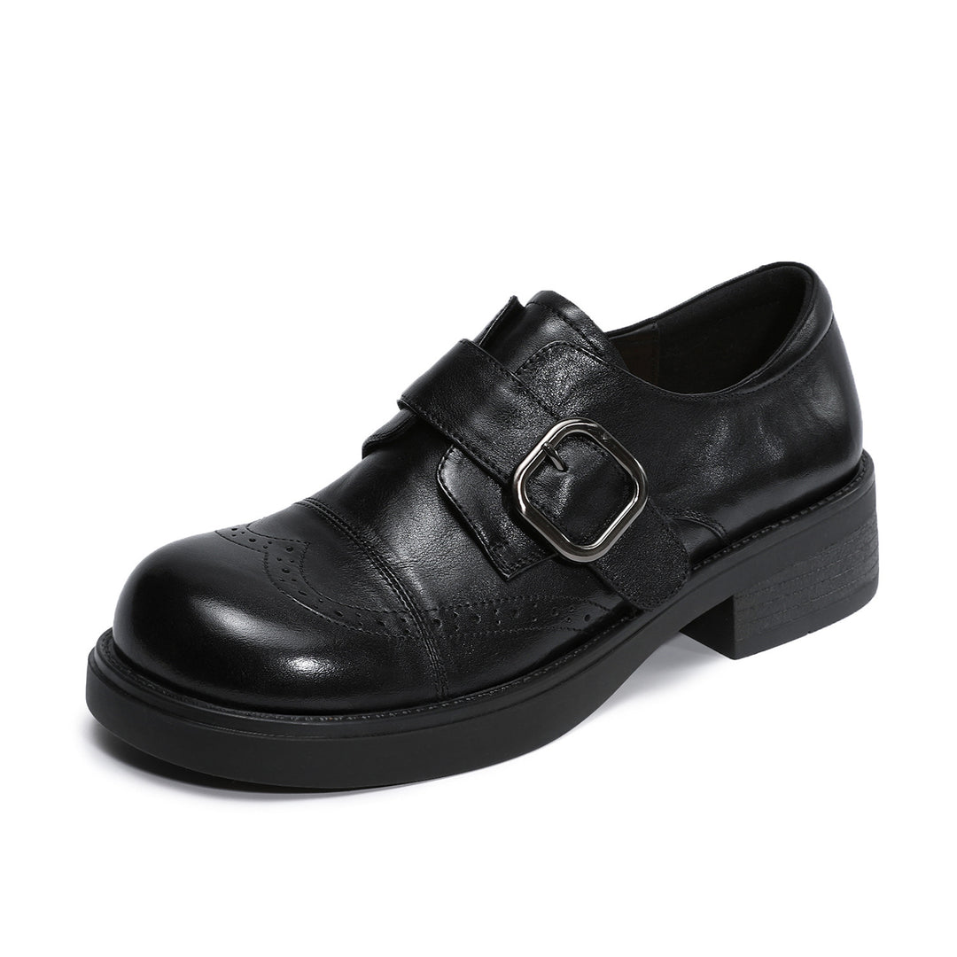 A single black leather platform shoe with a double strap closure and a silver-tone buckle, shown from a three-quarters angle on a white background.